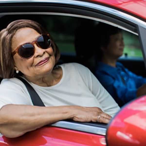 senior riding in car
