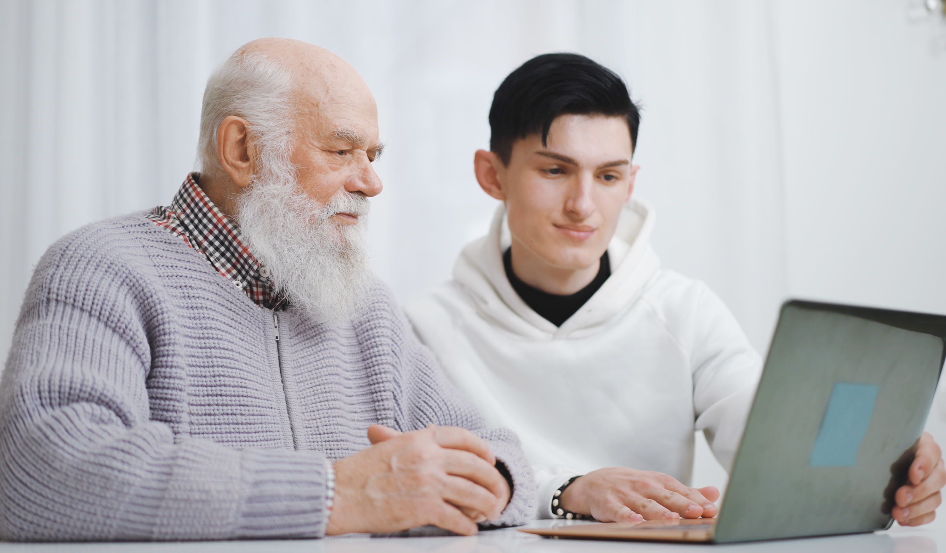 young-man-showing-senior-pc-things