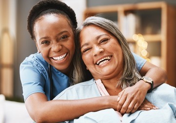 staff woman hugging senior - near u and me